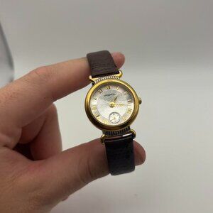Vintage women’s Fossil watch with gold trim and black adjustable leather band!